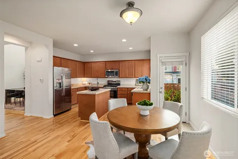 a view of a dining room with furniture window and wooden floor