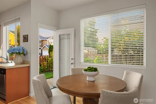 a dining room with furniture and window