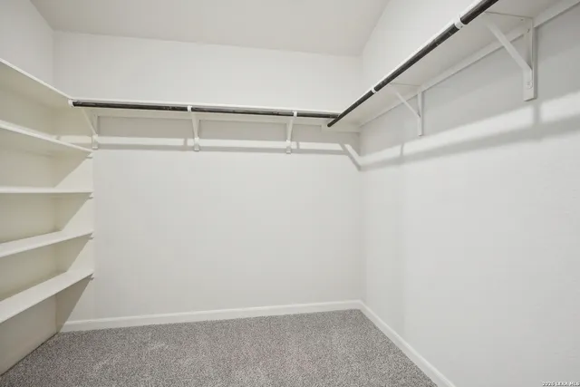 a view of a dining room with furniture and window
