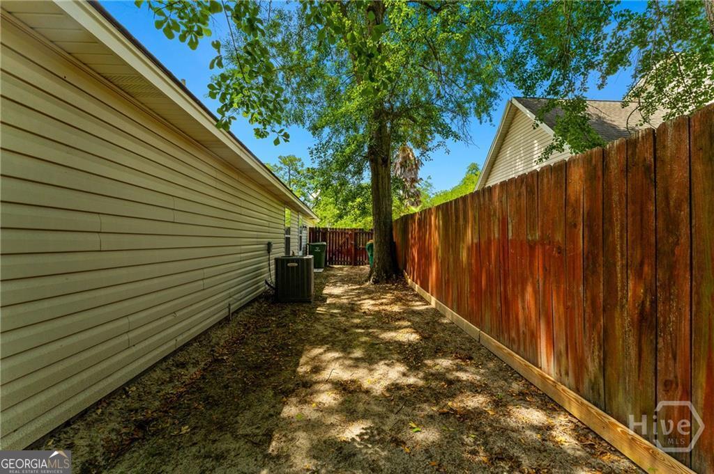 10 Fox Hound Court Pooler, GA 31322 - Photo 32 of 32 a view of a backyard with pathway