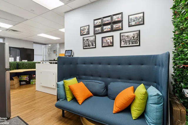 a workspace with furniture and wooden floor