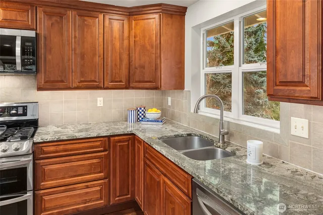a kitchen with a stove and a microwave