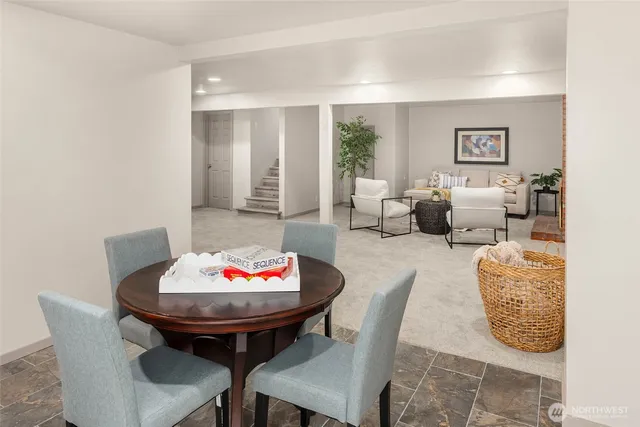 a bathroom with a granite countertop sink a toilet and a bathtub