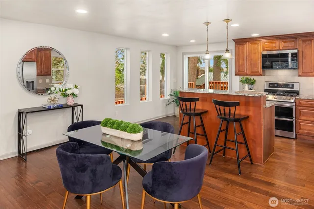 a view of a dining room with furniture window and wooden floor