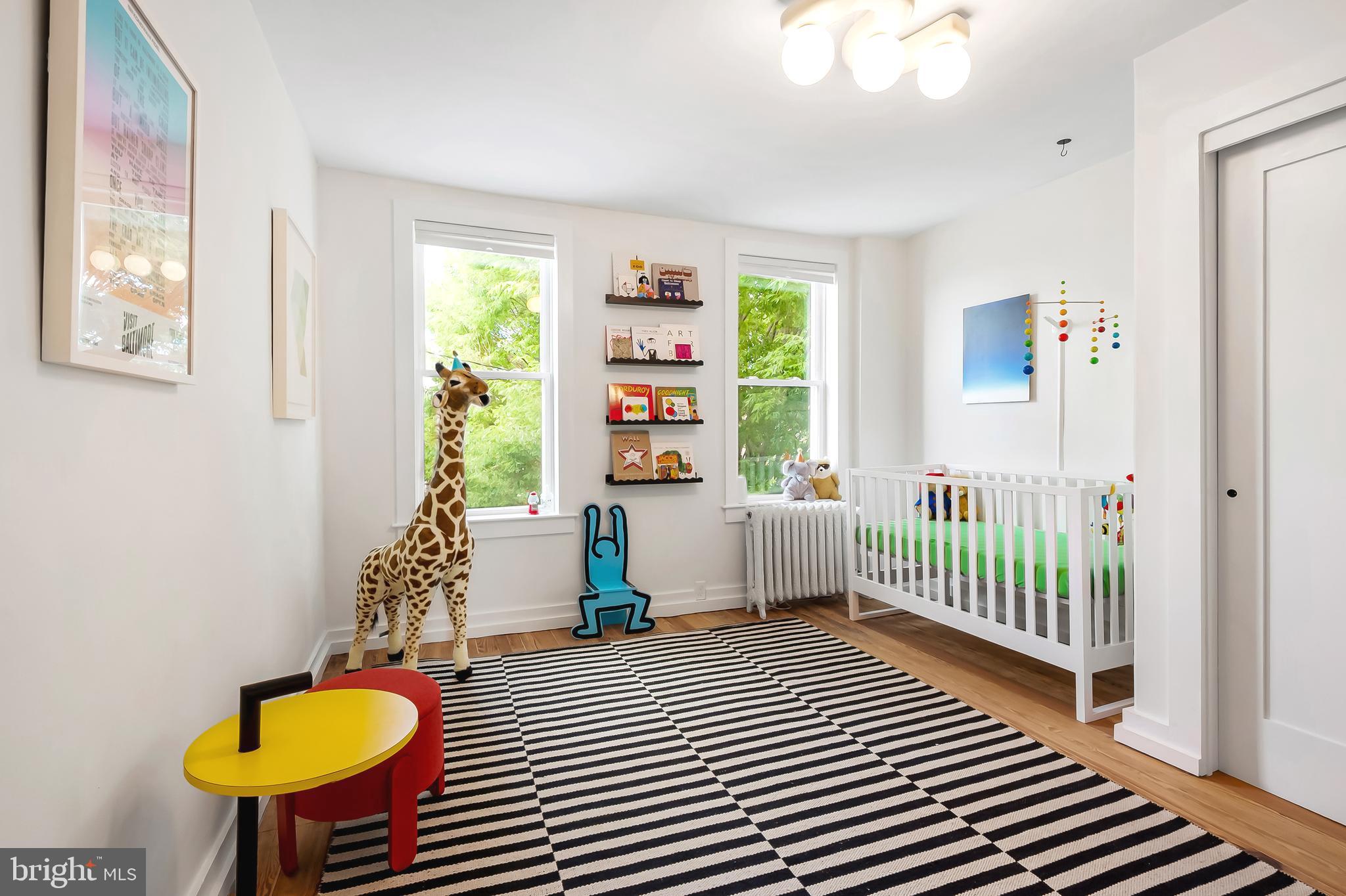 3409 Keswick Road Baltimore, MD 21211 - Photo 21 of 49 a bedroom with a bed and a window