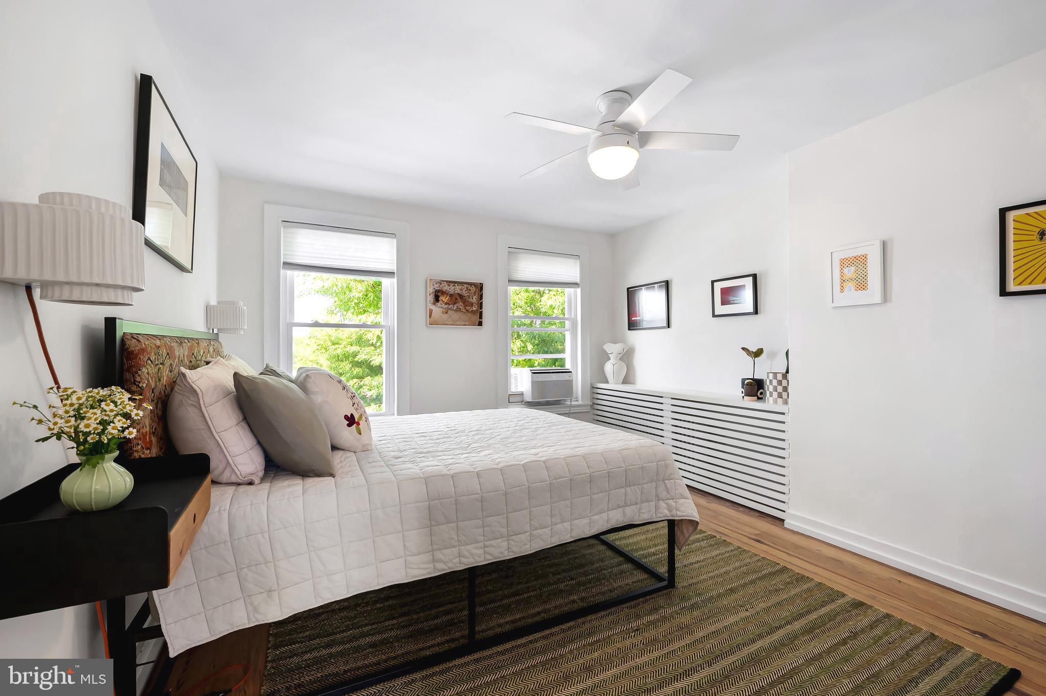 3409 Keswick Road Baltimore, MD 21211 - Photo 31 of 49 a bedroom with a bed and dresser with mirror