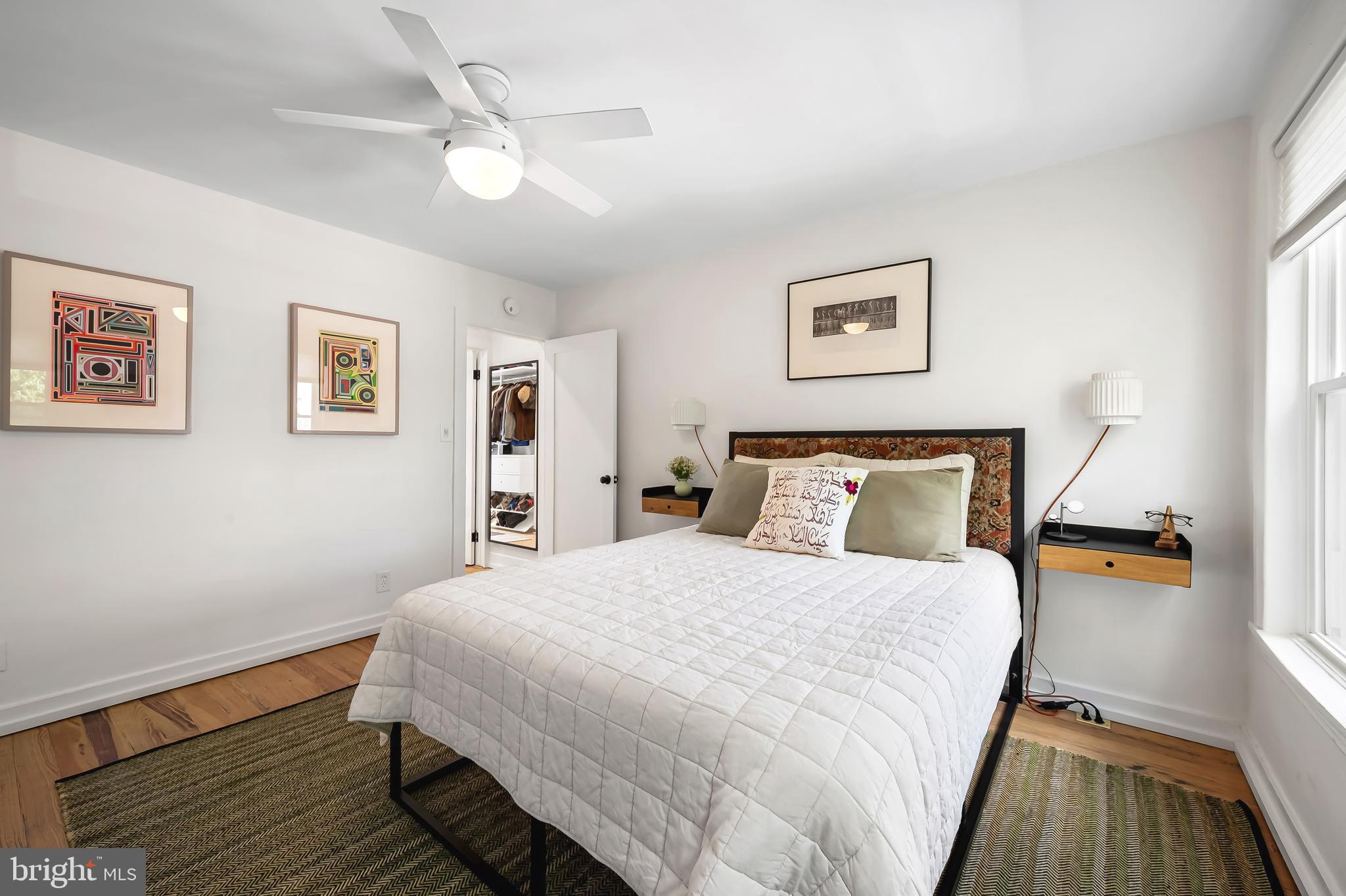 3409 Keswick Road Baltimore, MD 21211 - Photo 33 of 49 a bedroom with a bed and wooden floor