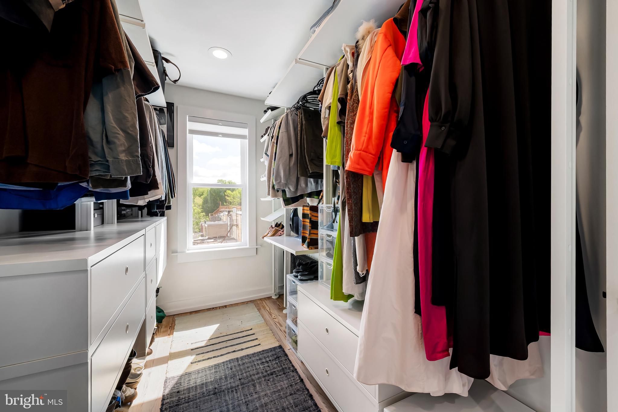 3409 Keswick Road Baltimore, MD 21211 - Photo 35 of 49 a view of walk in closet with clothes and shoes