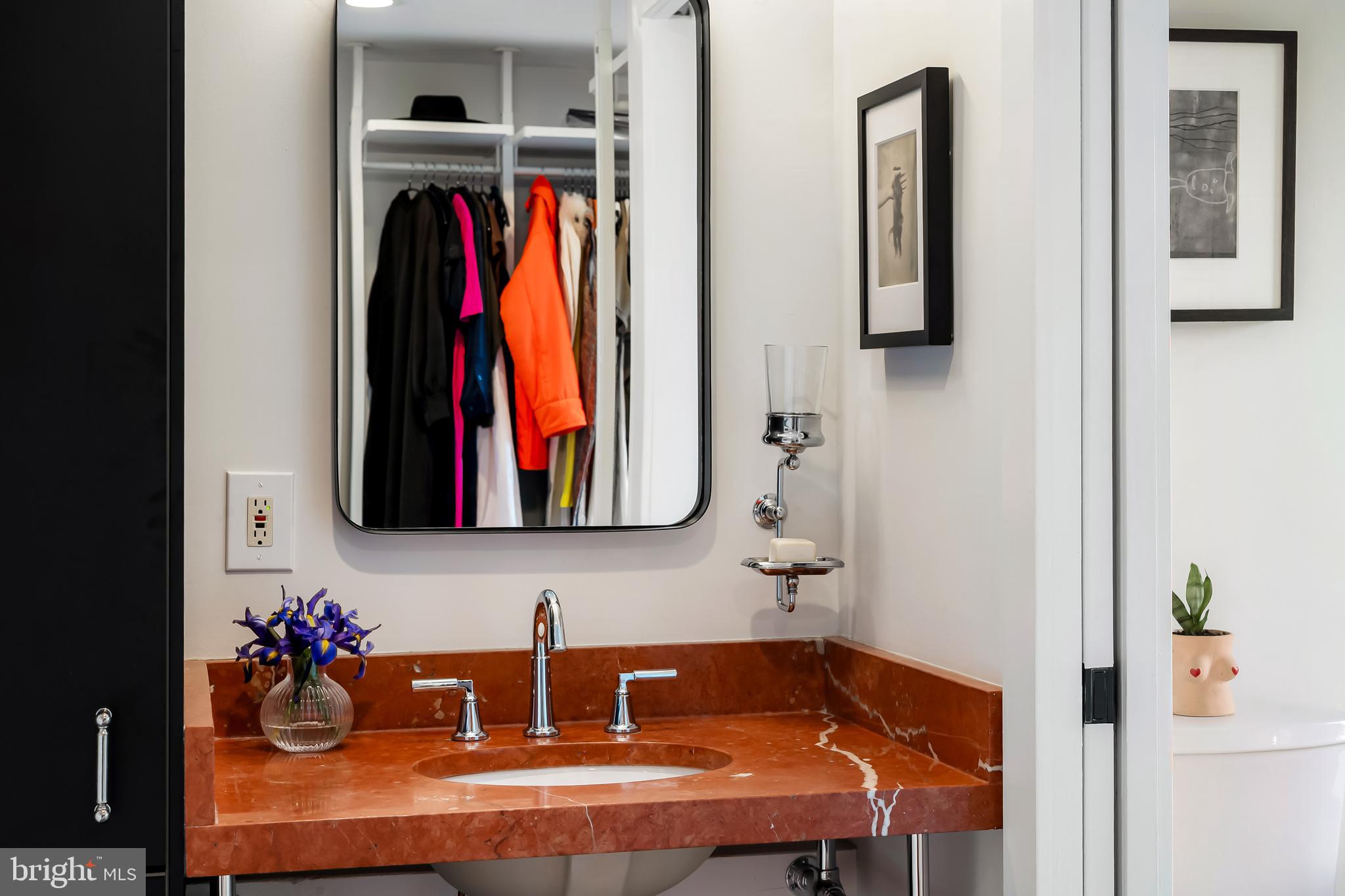 3409 Keswick Road Baltimore, MD 21211 - Photo 37 of 49 a bathroom with a sink and a mirror