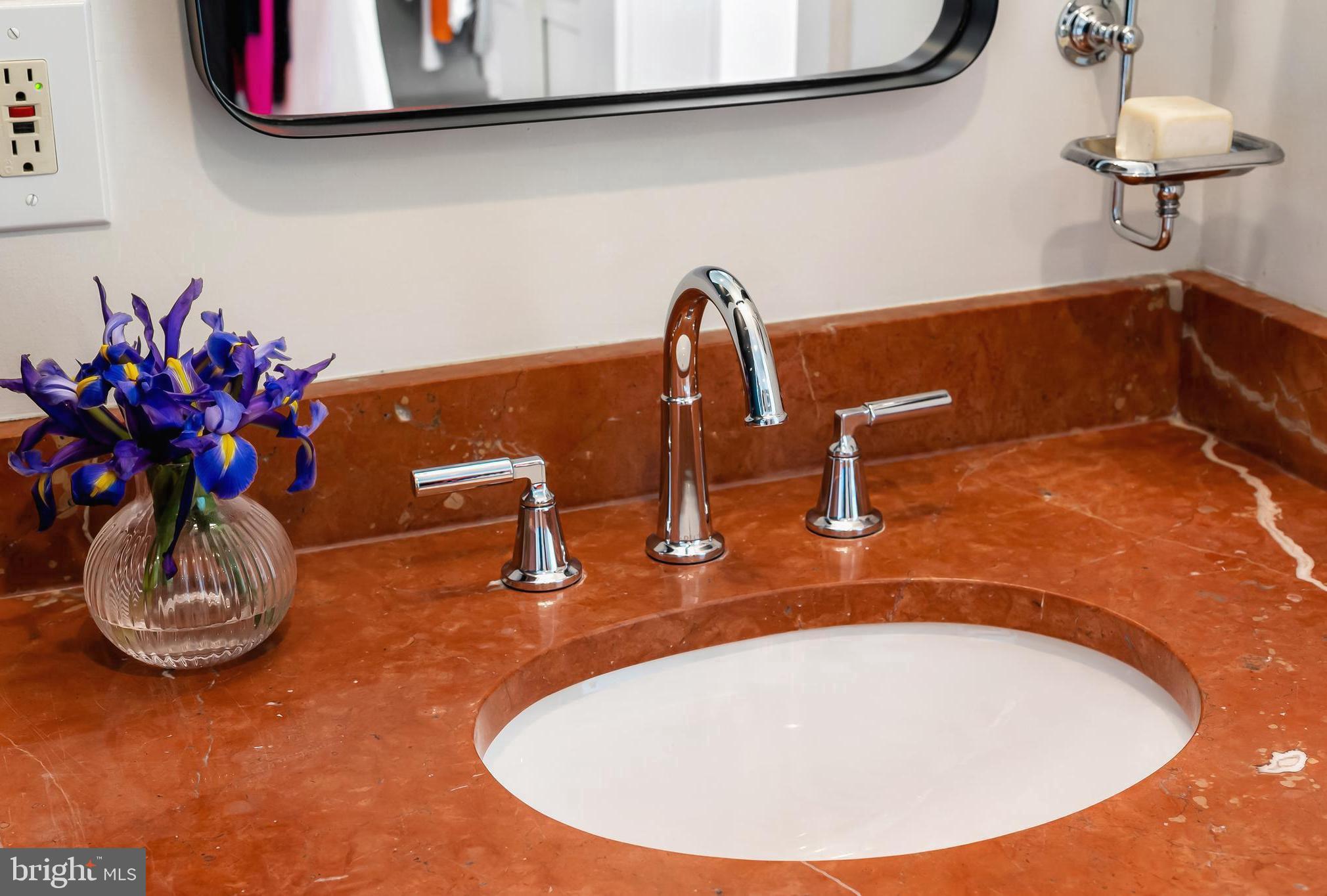3409 Keswick Road Baltimore, MD 21211 - Photo 38 of 49 a bathroom with a sink and a mirror