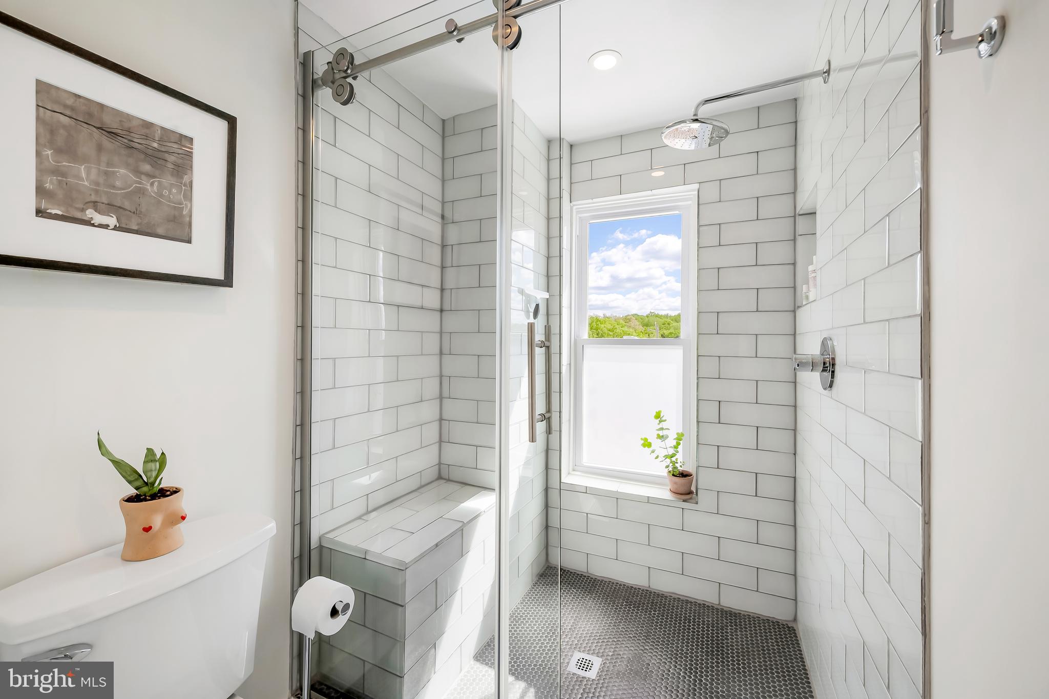 3409 Keswick Road Baltimore, MD 21211 - Photo 39 of 49 a bathroom with a shower and a toilet