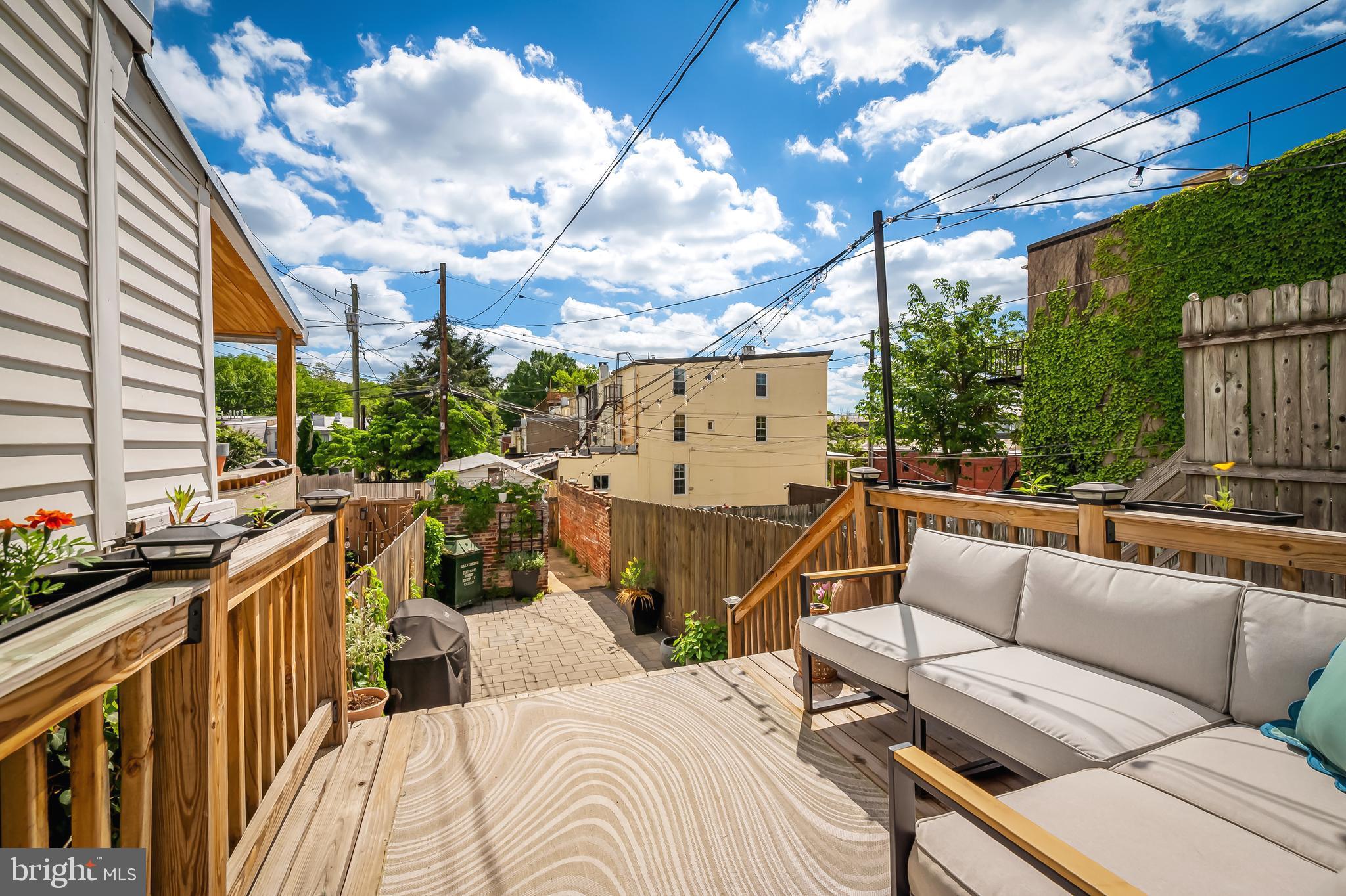 3409 Keswick Road Baltimore, MD 21211 - Photo 42 of 49 a view of a roof deck with couches and potted plants