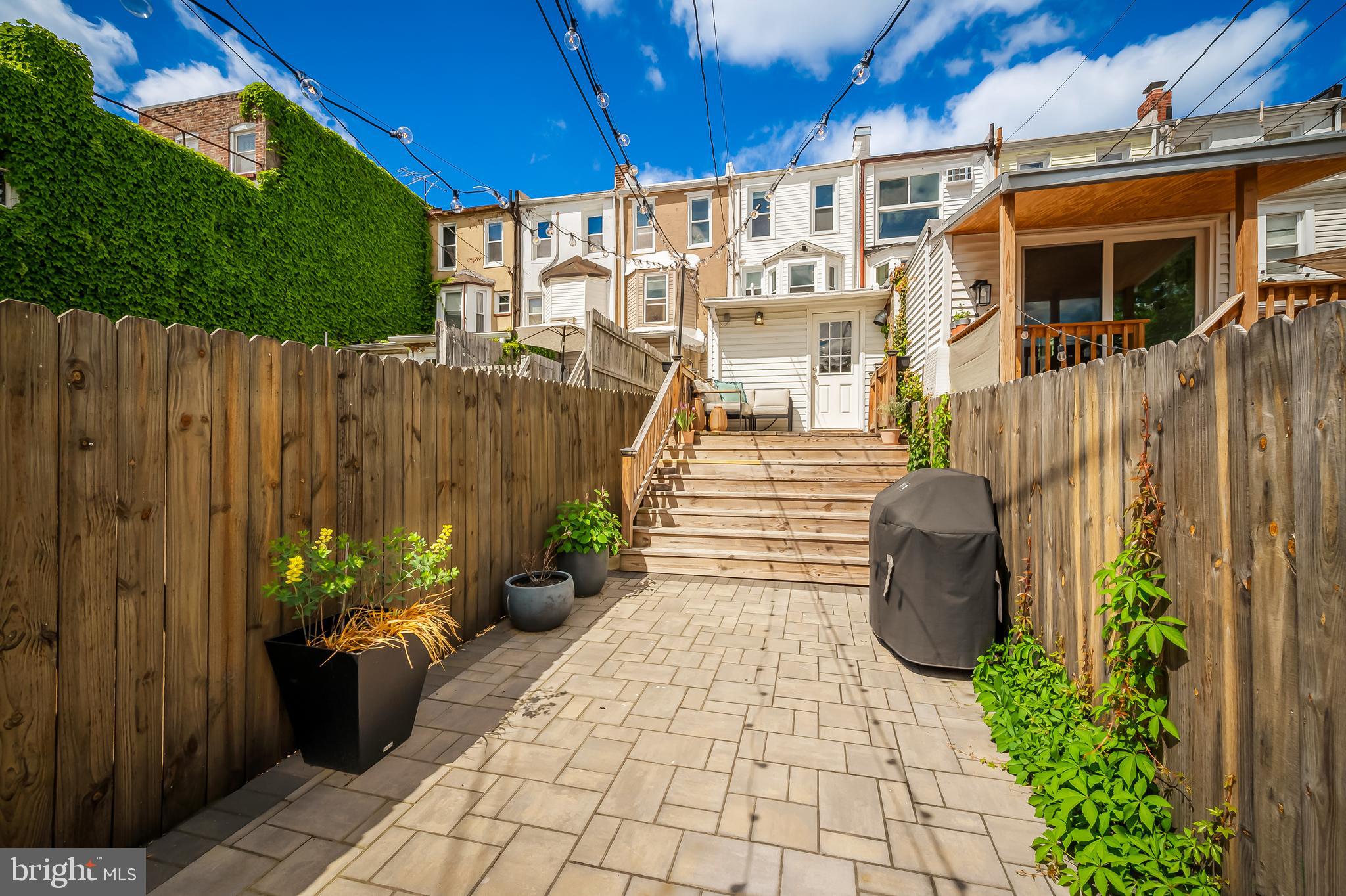 3409 Keswick Road Baltimore, MD 21211 - Photo 47 of 49 a view of a house with a potted plant and a chair
