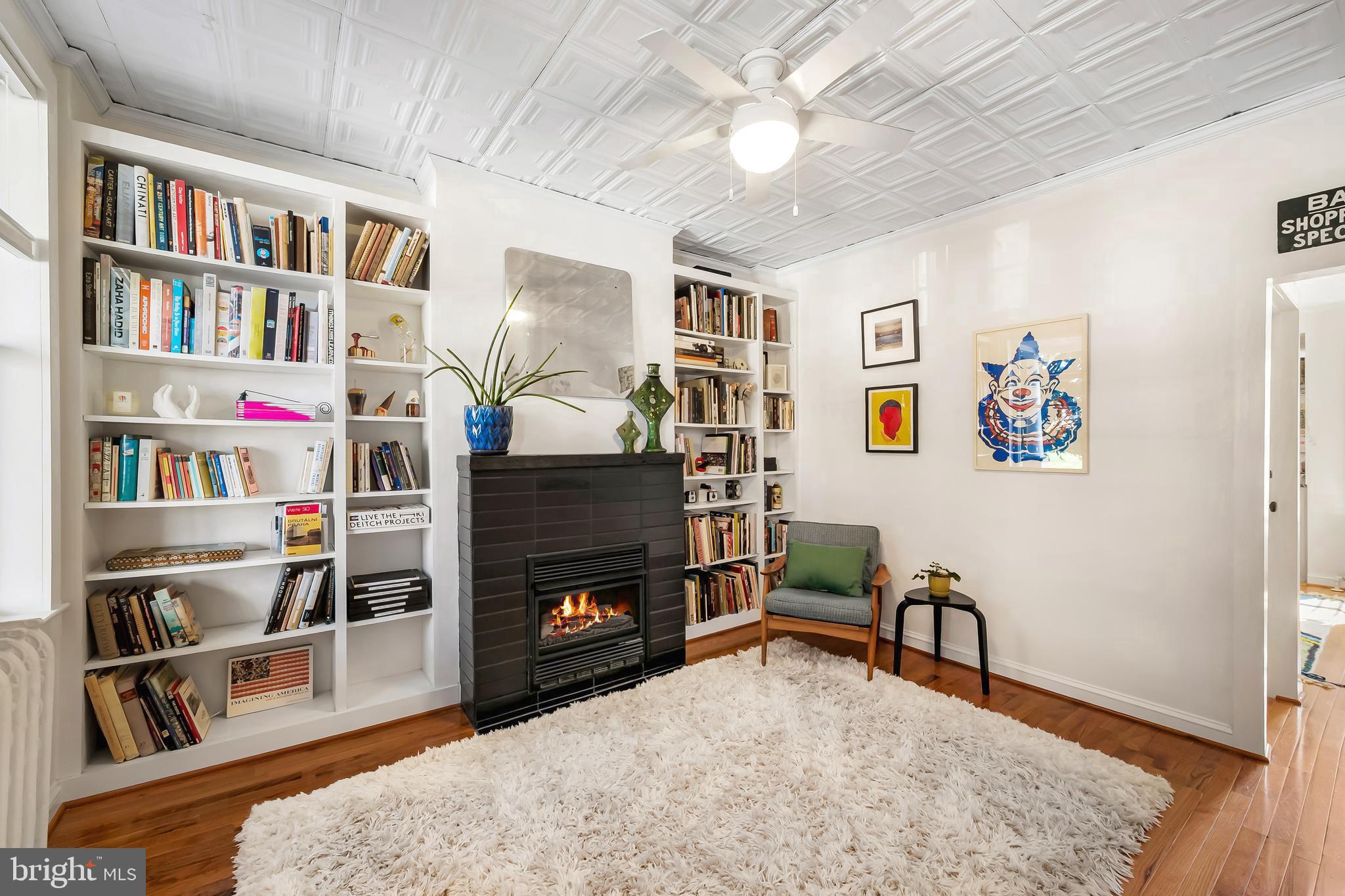 3409 Keswick Road Baltimore, MD 21211 - Photo 6 of 49 a living room with furniture and a book shelf