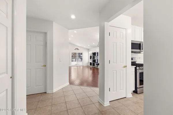 a view of a hallway with a dining room