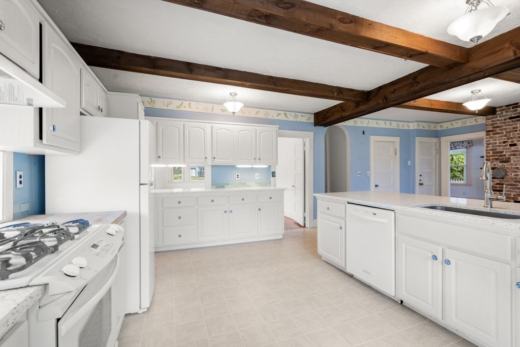142 Pelham Island Road Wayland, MA 01778 - Photo 19 of 39 a kitchen with cabinets appliances and a window