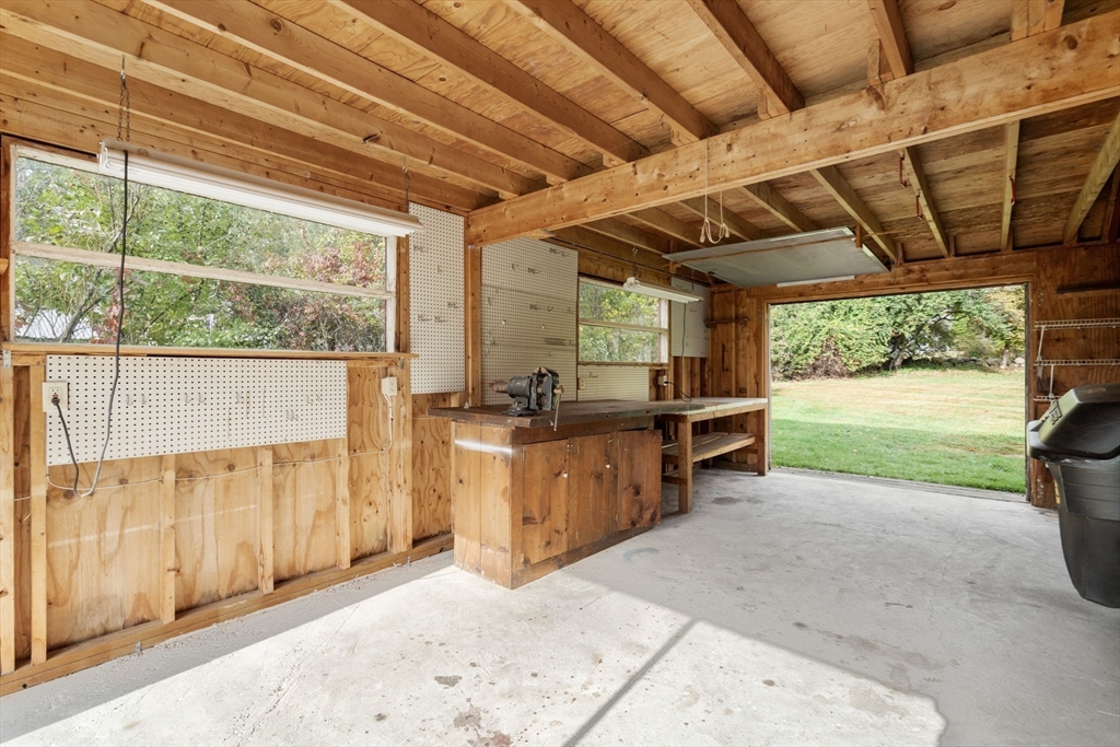 142 Pelham Island Road Wayland, MA 01778 - Photo 36 of 39 a view of a porch with furniture and a backyard