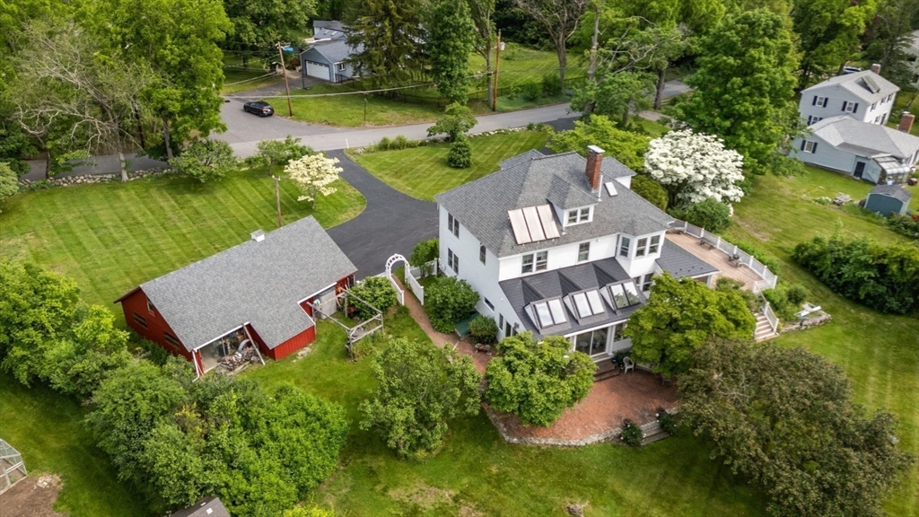 142 Pelham Island Road Wayland, MA 01778 - Photo 4 of 39 an aerial view of a house with a garden and lake view