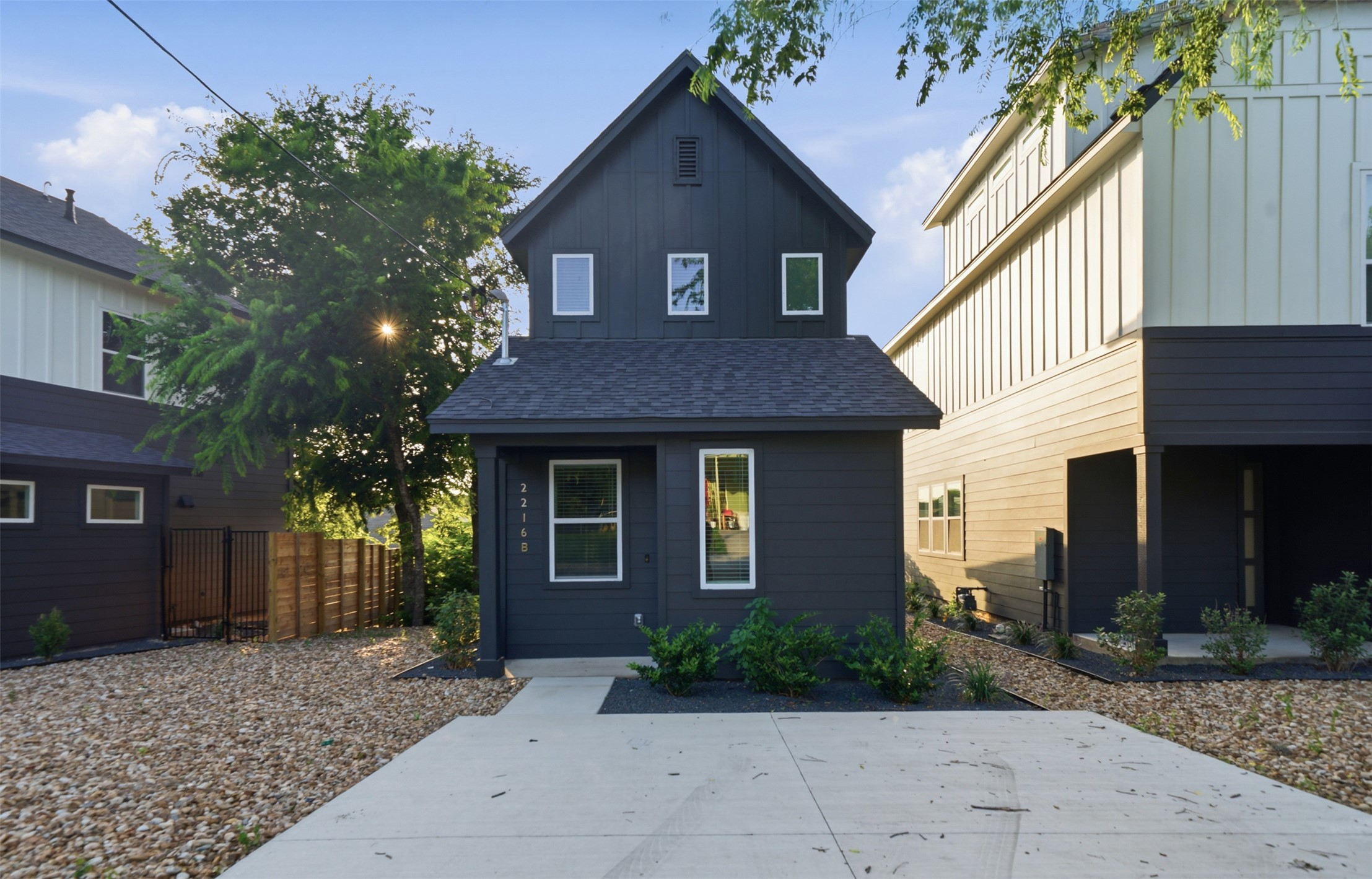 2216 Yellow Jacket Lane, Unit 2 Austin, TX 78741 - Photo 2 of 25 a front view of a house with garden