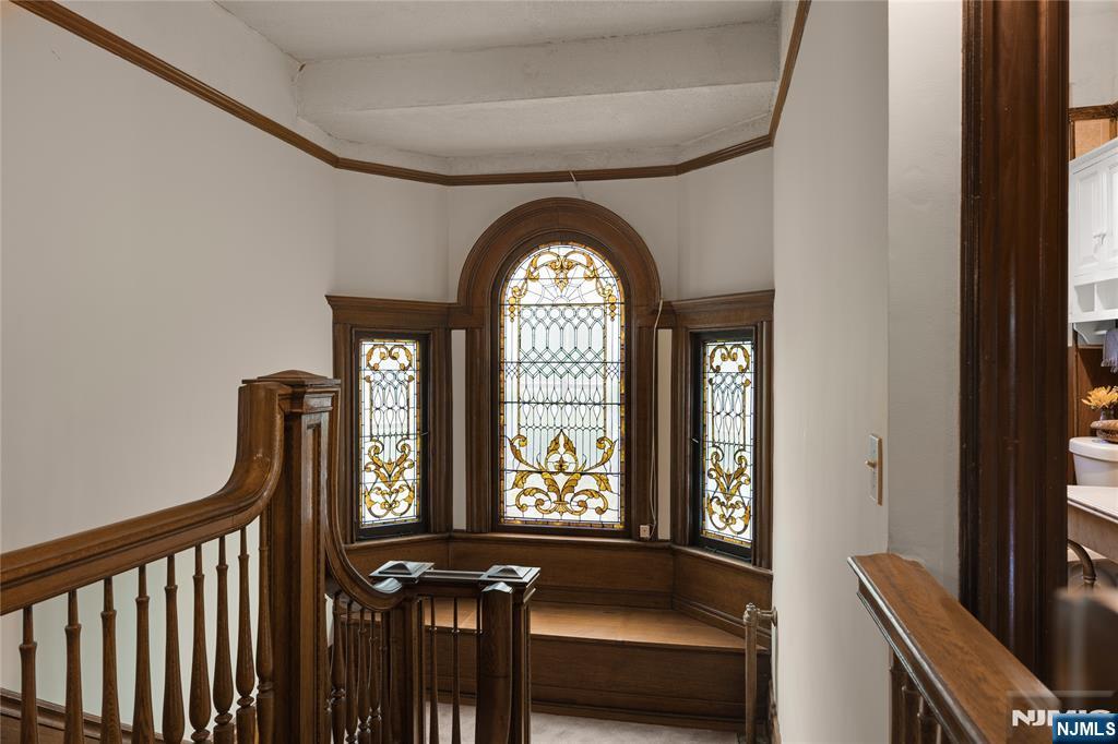 119 High Street Passaic, NJ 07055 - Photo 14 of 38 a view of a hallway with wooden floor and windows