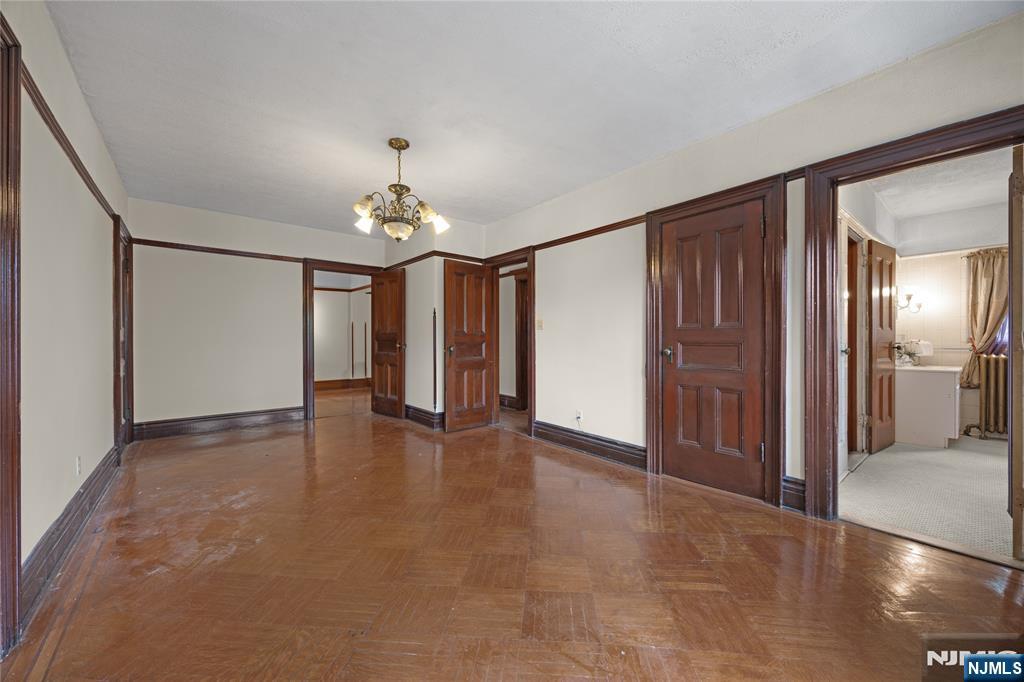 119 High Street Passaic, NJ 07055 - Photo 17 of 38 a view of an empty room with window and chandelier fan