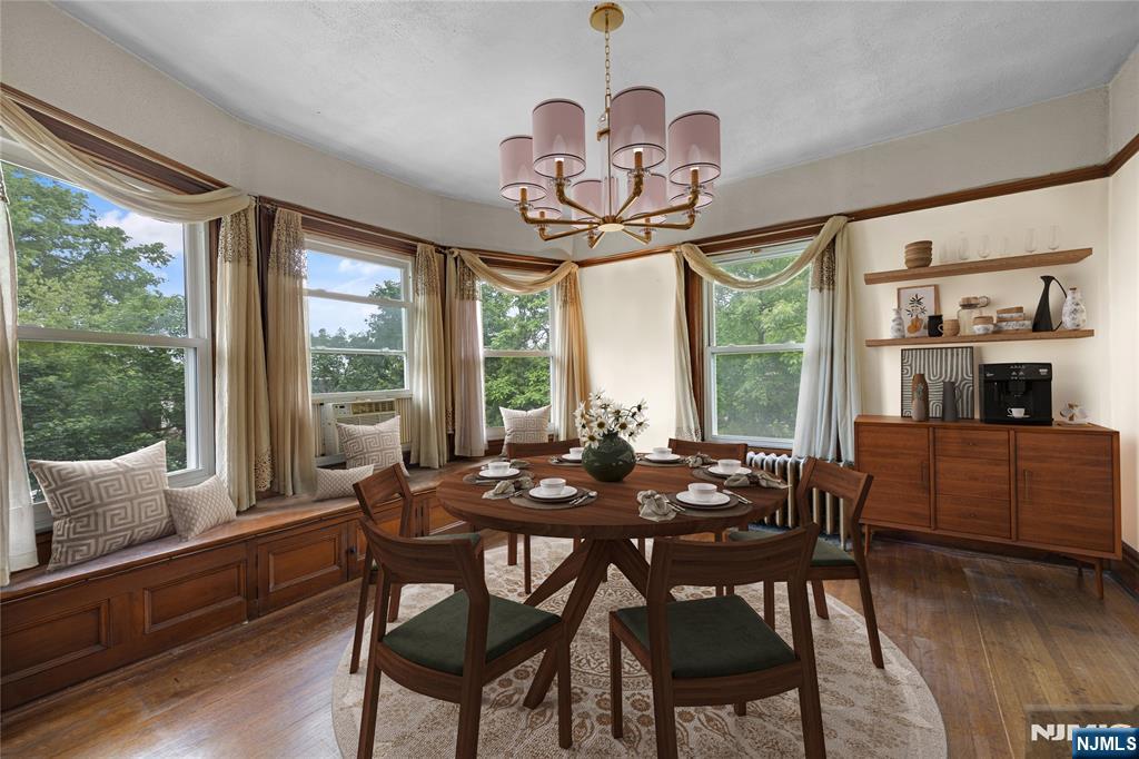 119 High Street Passaic, NJ 07055 - Photo 18 of 38 a view of a dining room with furniture window and wooden floor