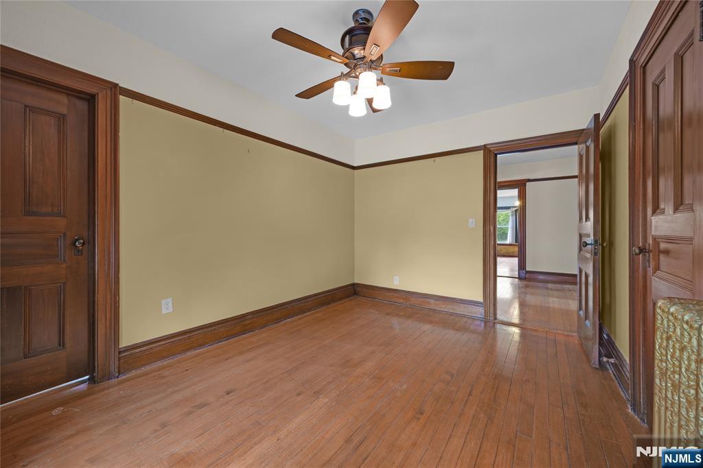 119 High Street Passaic, NJ 07055 - Photo 25 of 38 wooden floor in an empty room with a window