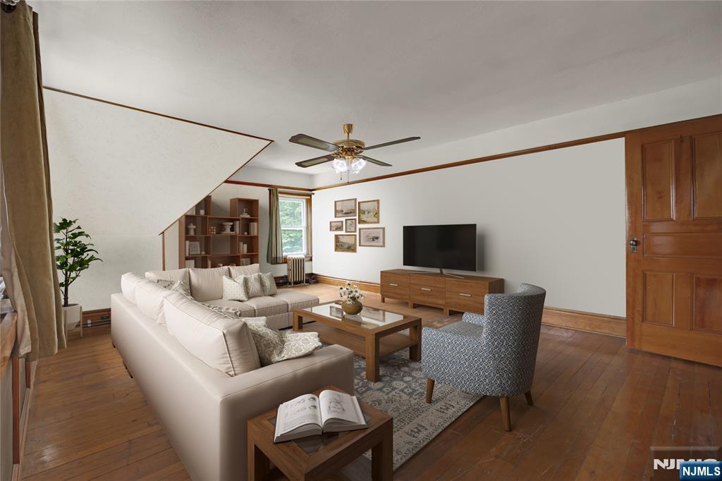 119 High Street Passaic, NJ 07055 - Photo 29 of 38 a living room with furniture and a flat screen tv