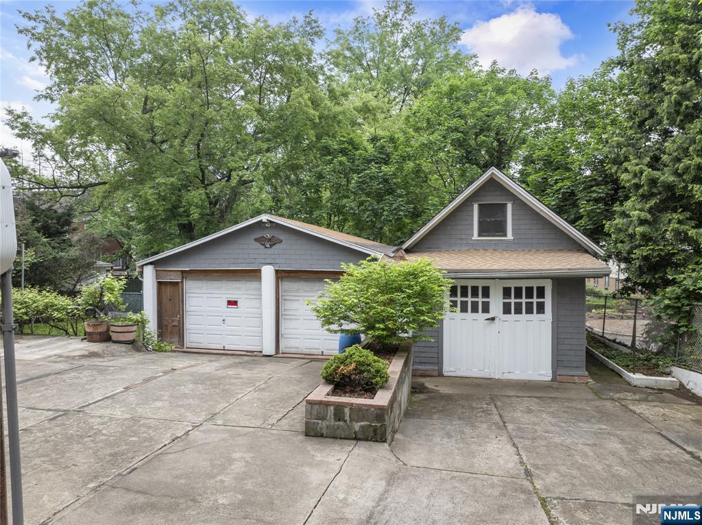 119 High Street Passaic, NJ 07055 - Photo 35 of 38 a front view of a house with a garden