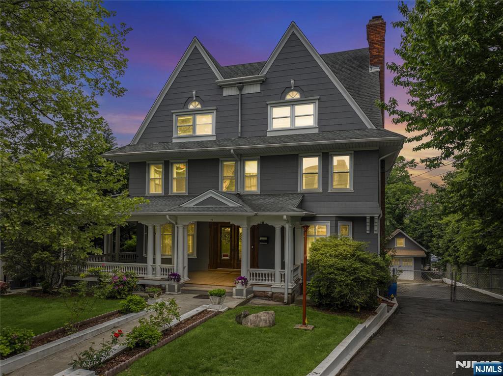 119 High Street Passaic, NJ 07055 - Photo 37 of 38 a front view of a house with garden and porch