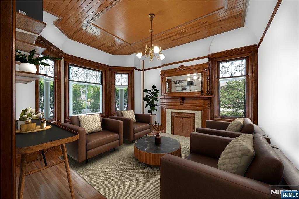 119 High Street Passaic, NJ 07055 - Photo 4 of 38 a living room with furniture fireplace and large windows