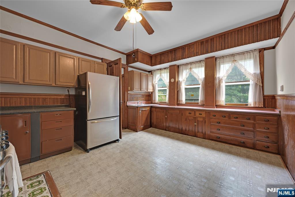 119 High Street Passaic, NJ 07055 - Photo 10 of 38 a kitchen with windows and chandelier