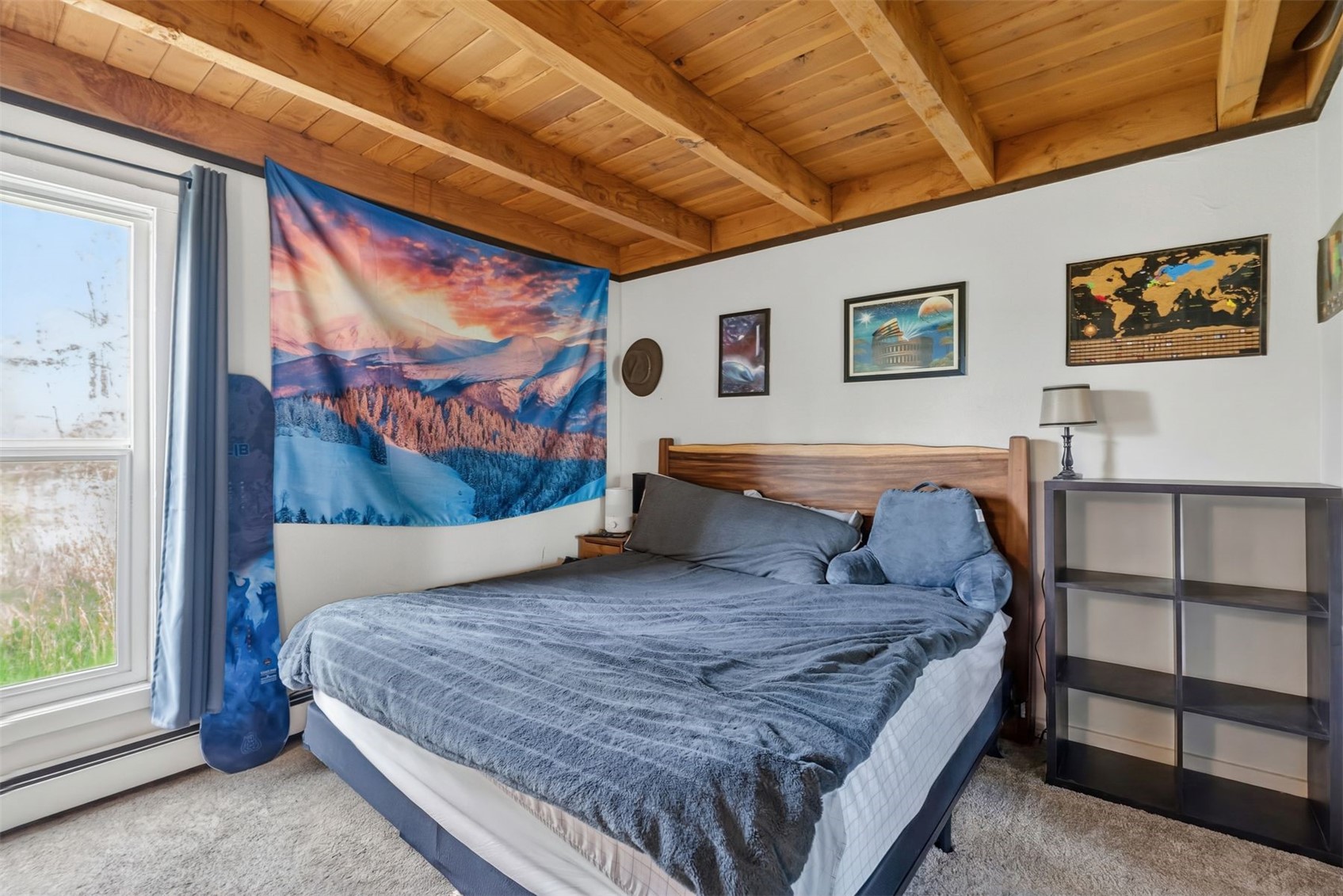 8100 Ryan Gulch Road, Unit 106 Wildernest, CO 80498 - Photo 20 of 43 a bedroom with a large bed and a painting on the wall
