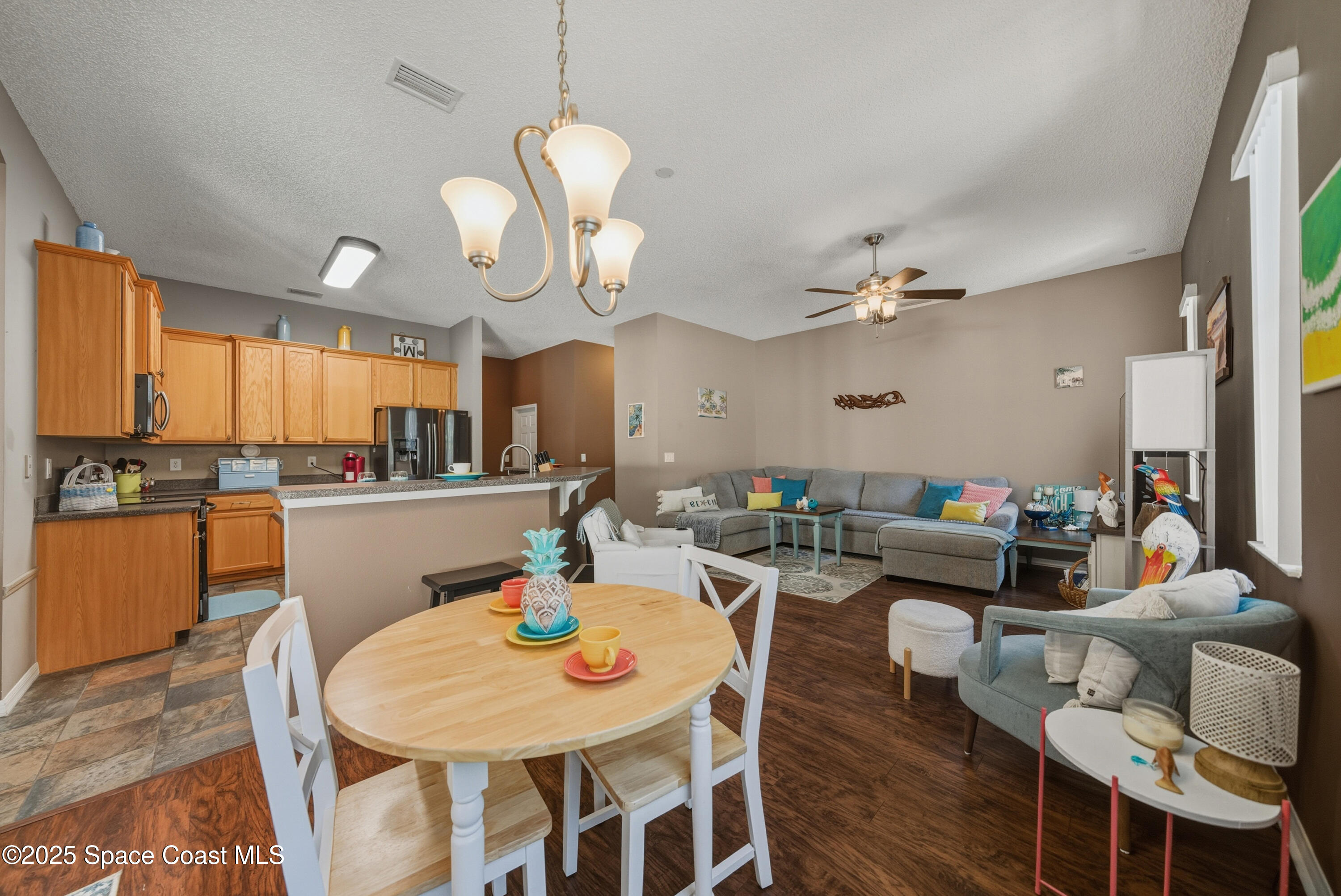 7368 Crepe Myrtle Court Cocoa, FL 32927 - Photo 14 of 50 a living room with dining table and chairs