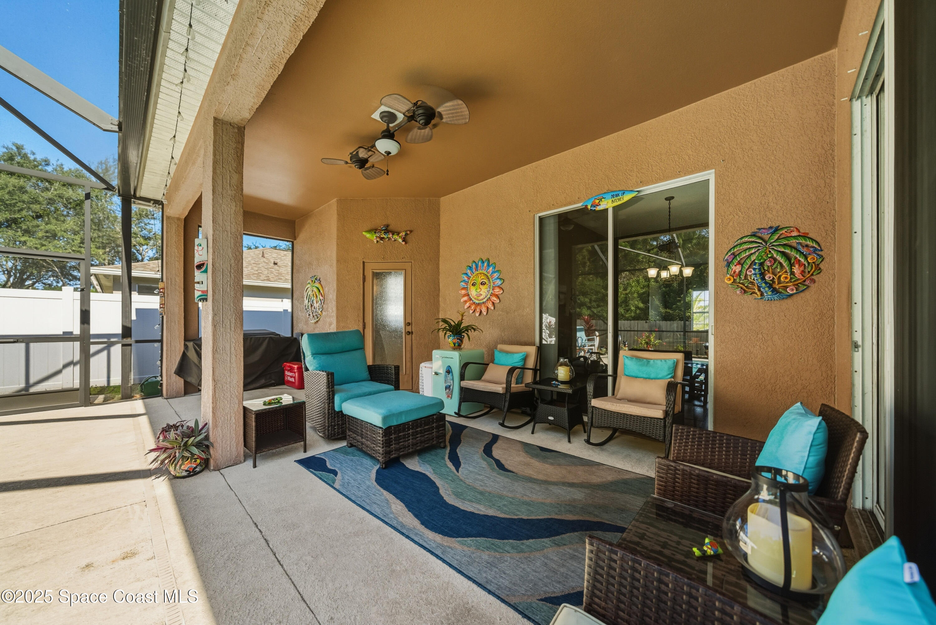 7368 Crepe Myrtle Court Cocoa, FL 32927 - Photo 36 of 50 a living room with furniture and a large window