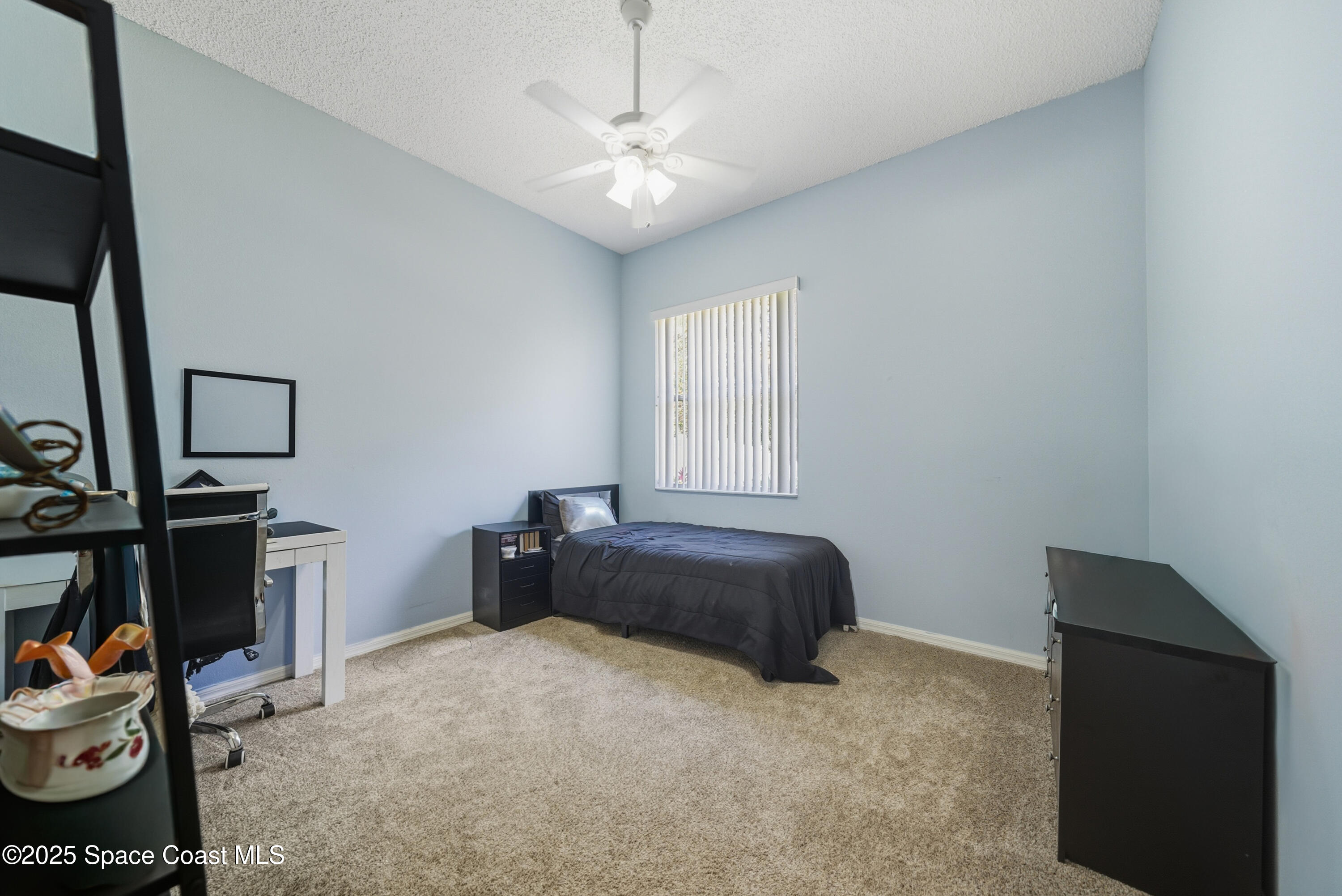 7368 Crepe Myrtle Court Cocoa, FL 32927 - Photo 39 of 50 a bedroom with furniture and a window