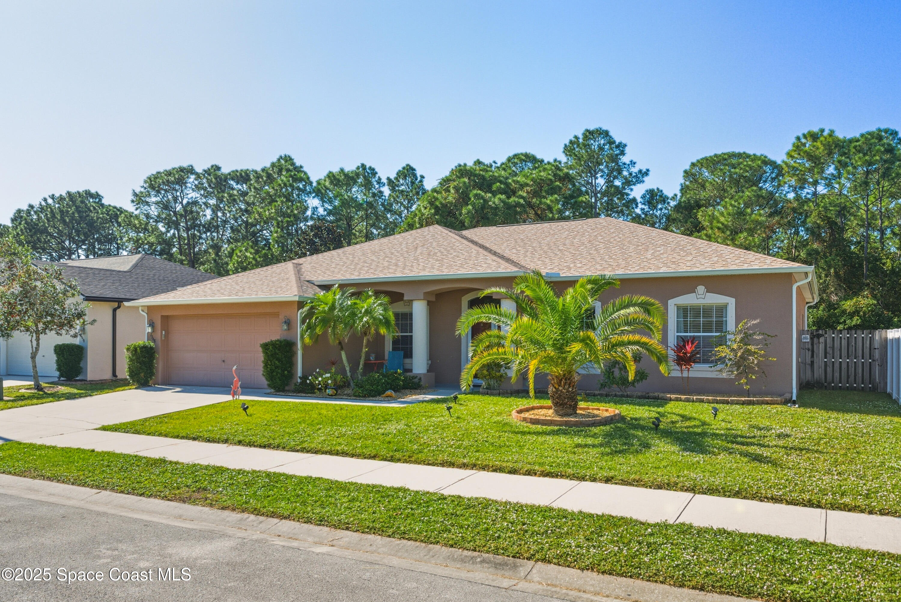 7368 Crepe Myrtle Court Cocoa, FL 32927 - Photo 46 of 50 a front view of house with yard and green space