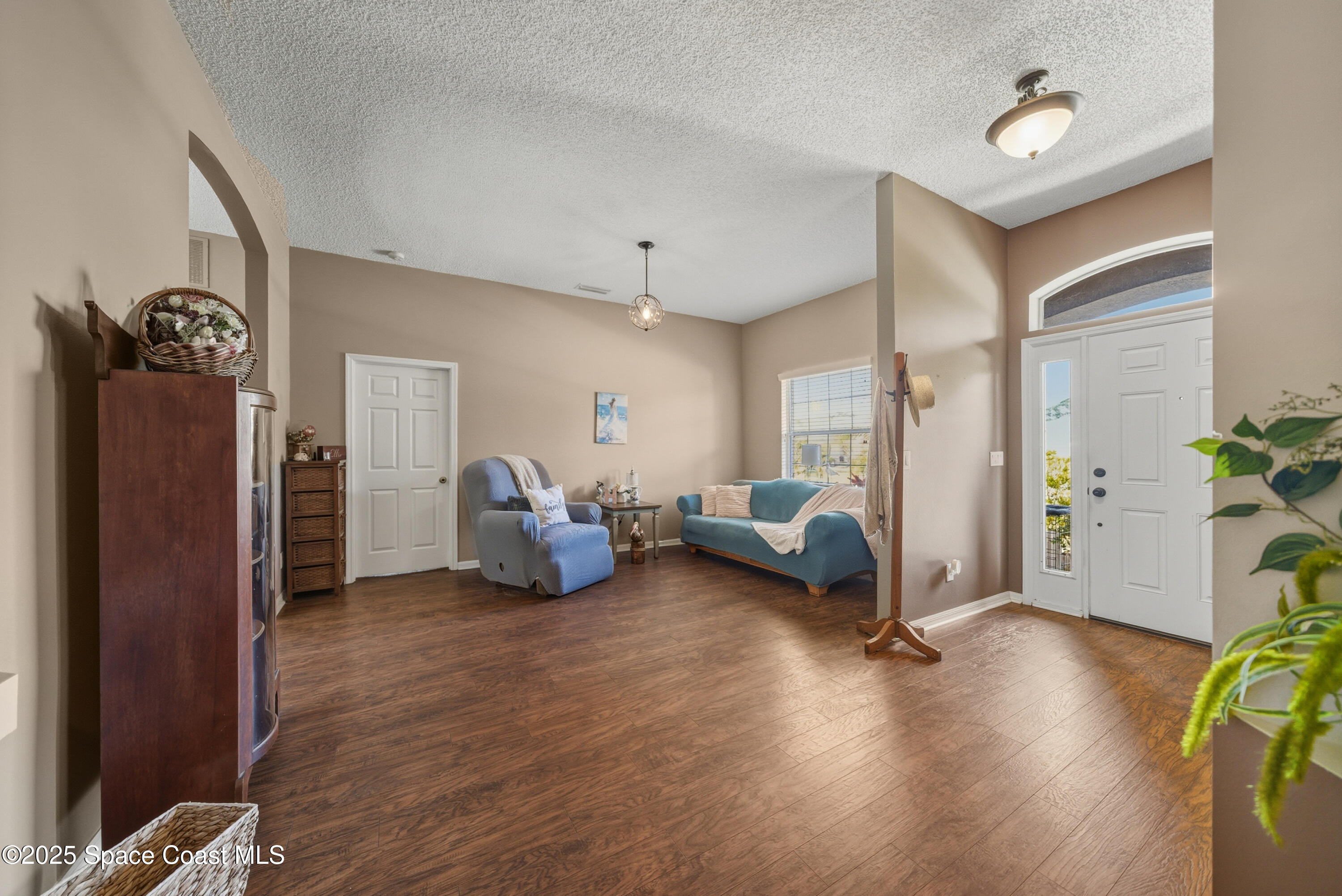7368 Crepe Myrtle Court Cocoa, FL 32927 - Photo 5 of 50 a living room with furniture a couch and a window