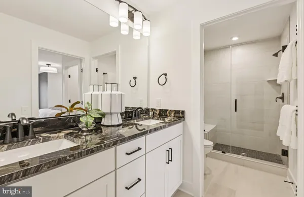 a bed room with a bed and a painting