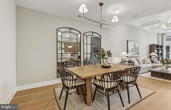 a view of staircase with wooden floor and a rug