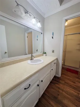 a spacious bathroom with a double vanity sink and a mirror