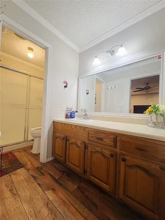 a spacious bathroom with double vanity and a mirror