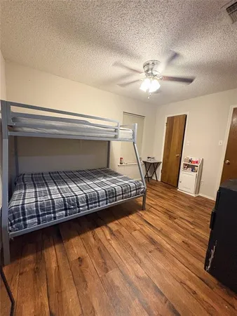 a bedroom with bed and window