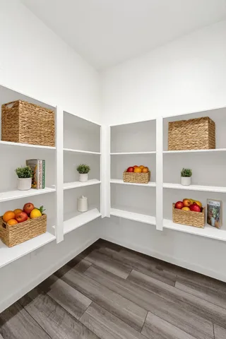 a workspace with furniture and baby crib