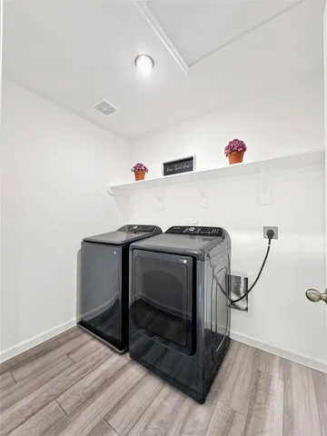 a utility room with washer and dryer