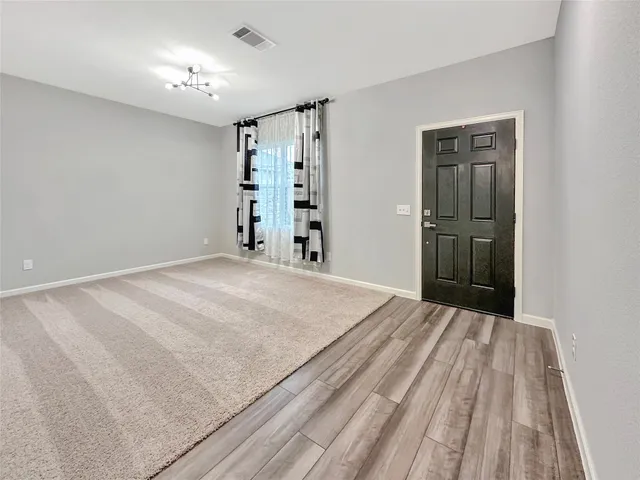 a view of a room with a front door