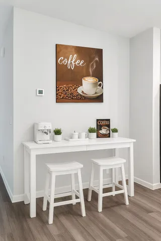 a white table sitting next to a white wooden cabinet