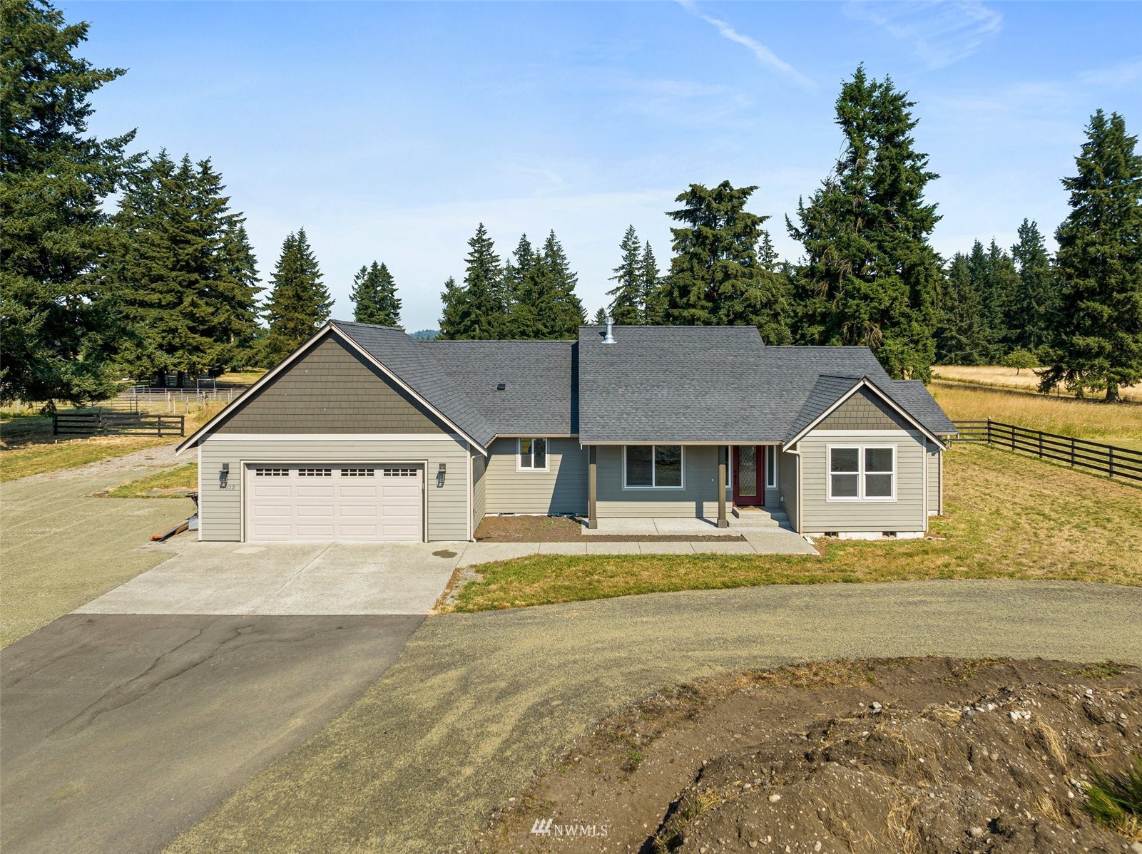 16622 Leitner Road Southwest Rochester, WA 98579 - Photo 1 of 29 a view of a big house with a big yard and large trees