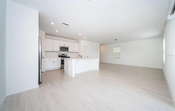 a view of kitchen with wooden floor