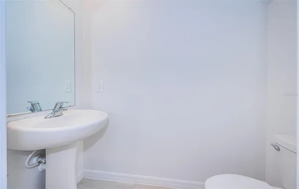 a bathroom with a sink a toilet